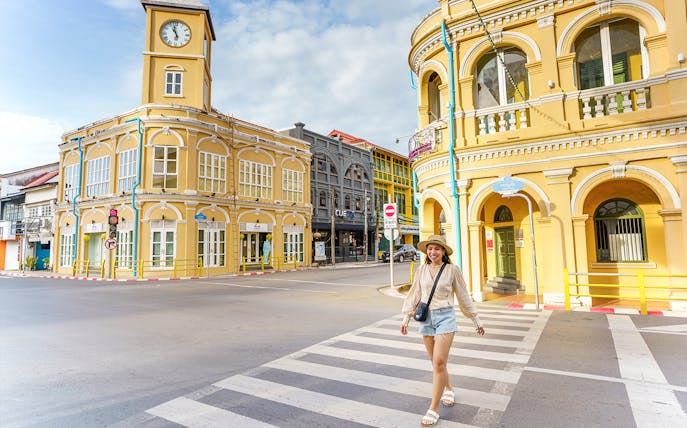 Traveler walking in Phuket Old Town with Sino-Portuguese architecture buildings, Phuket, Thailand.