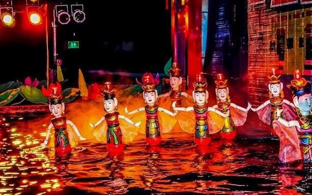 Thang Long Water Puppet Show with colorful puppets performing on water.