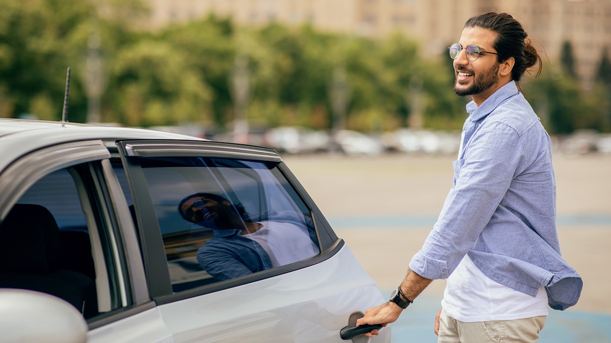 Man getting in a private car