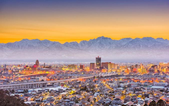 Toyama City skyline with mountains at dawn, Japan.