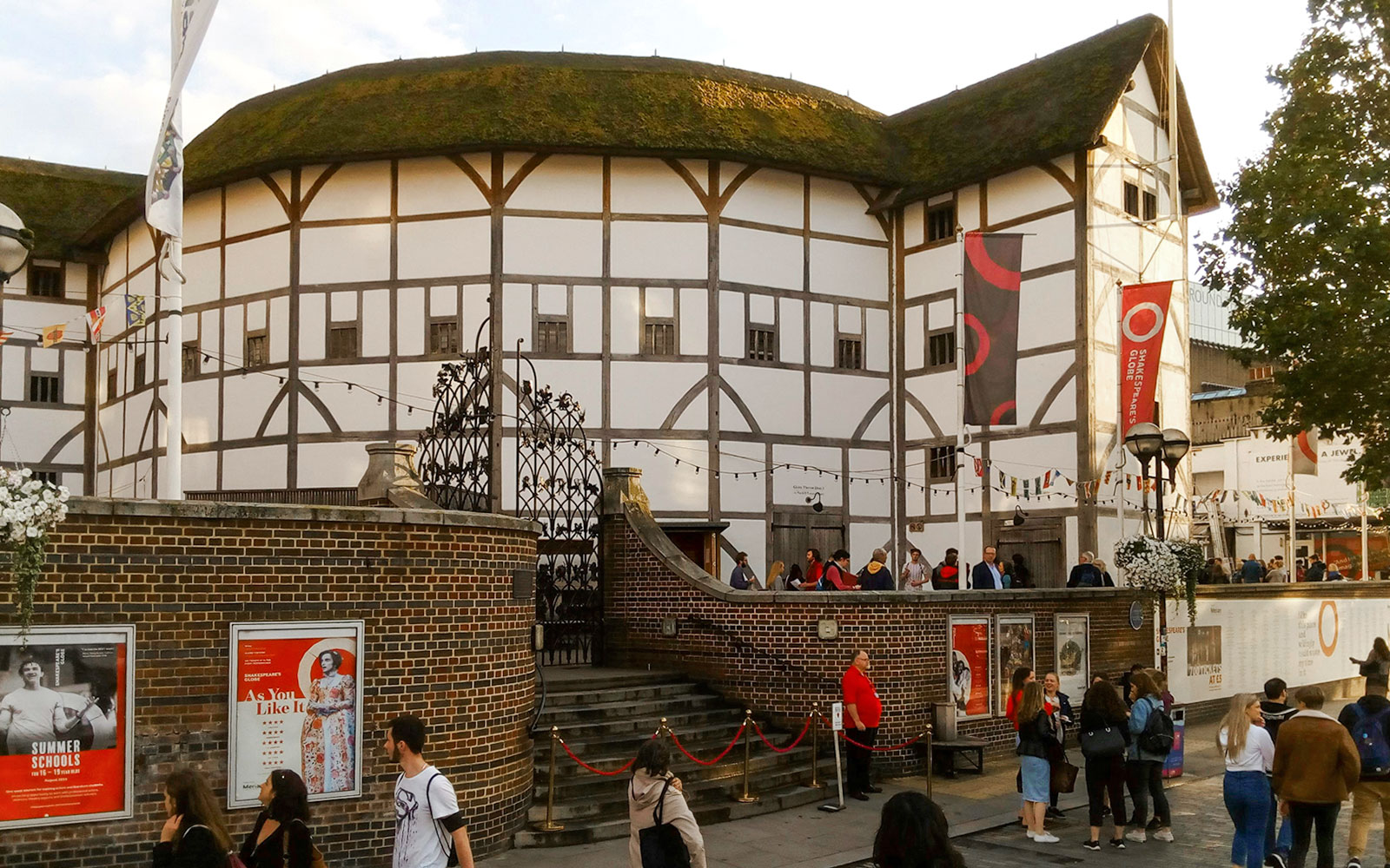 Group of people outside Shakespeare’s Globe Theatre in London.