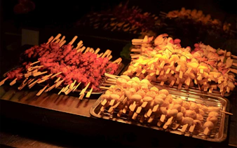 Grilled skewers on display during Riverside Kinlen Cruise in Bangkok.