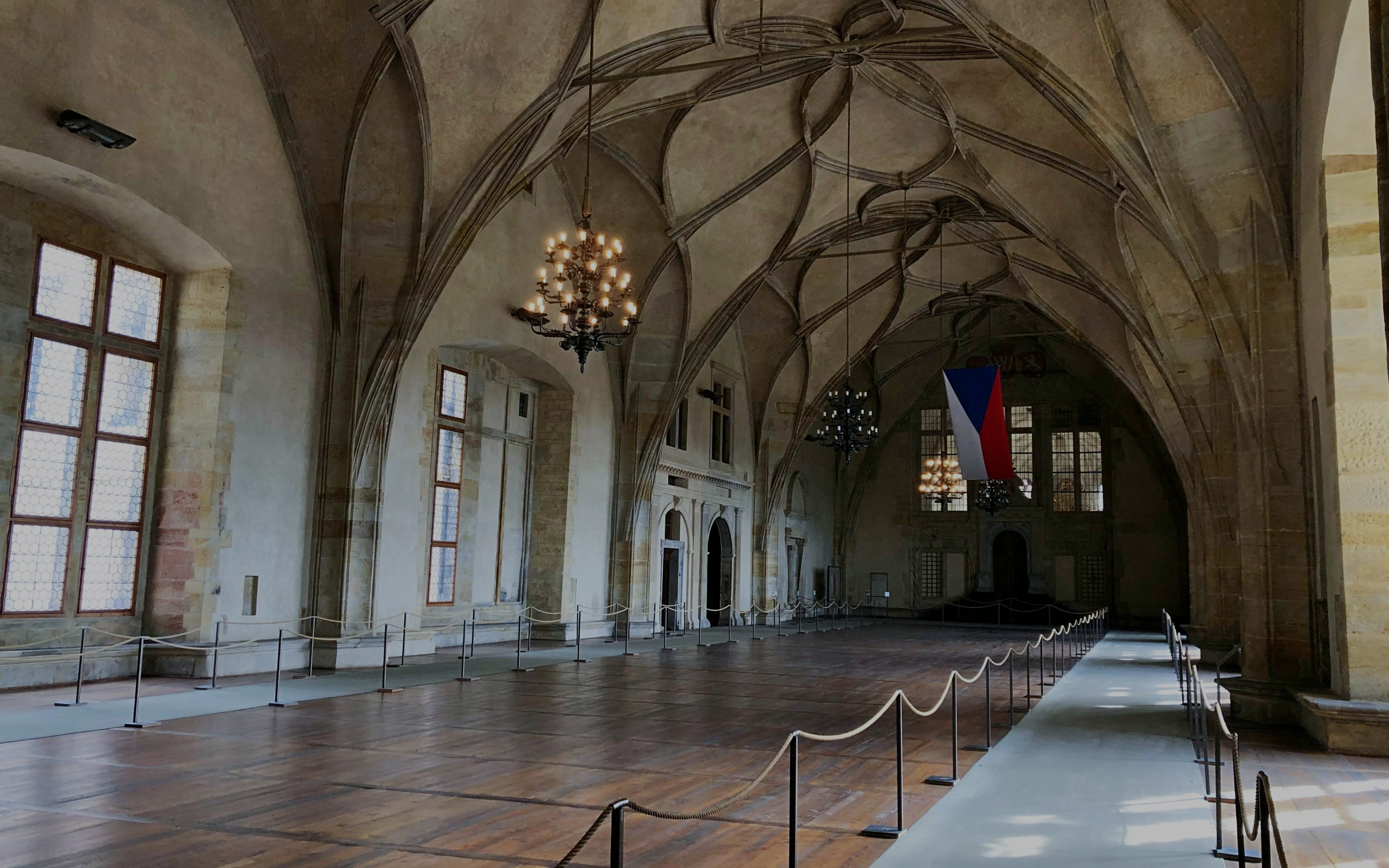 Vladislav Hall's vaulted ceiling and chandeliers at Prague Castle, Czech Republic.
