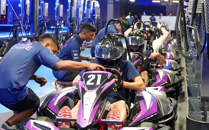 Go-kart racers preparing for HyperDrive experience.