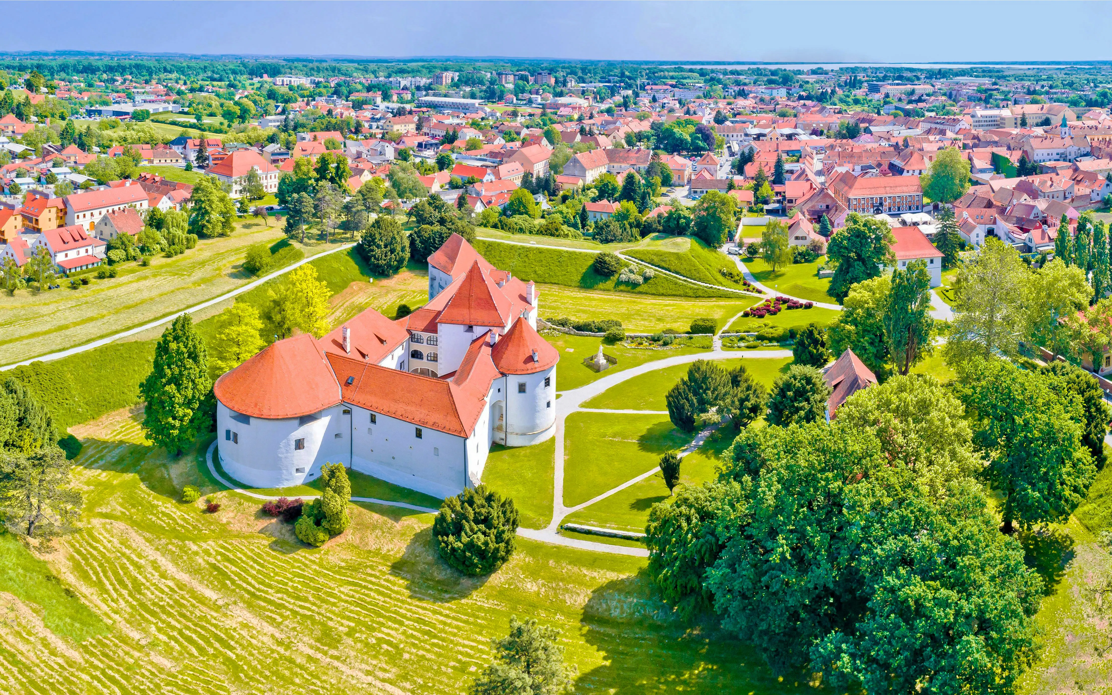 Aerial view of Varazdin's historic castle and surrounding town landscape.