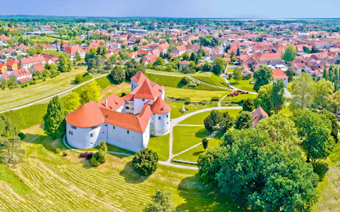 Aerial view of Varazdin's historic castle and surrounding town landscape.