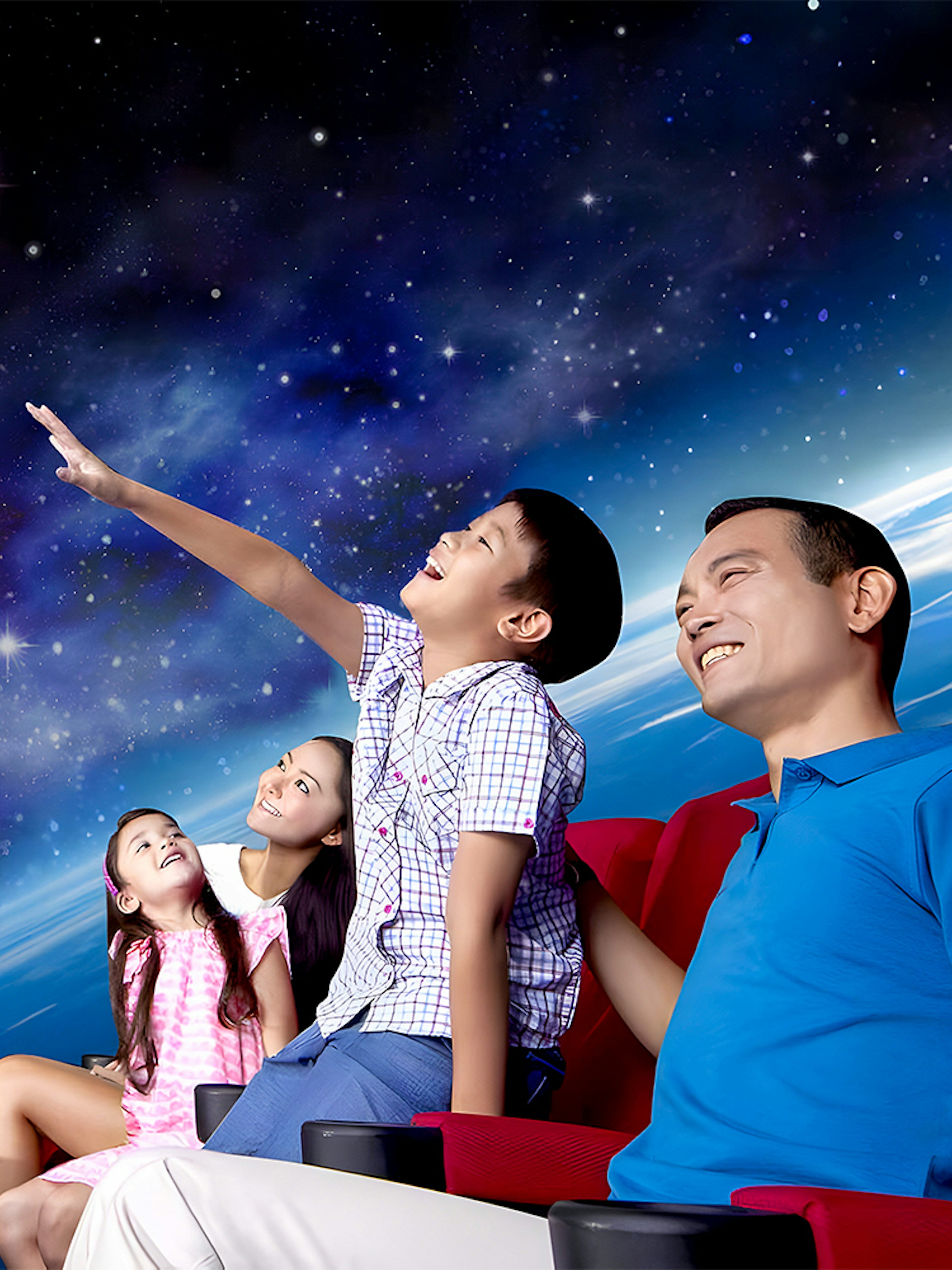 Visitors watching a space show at the Omni Theatre, Singapore.