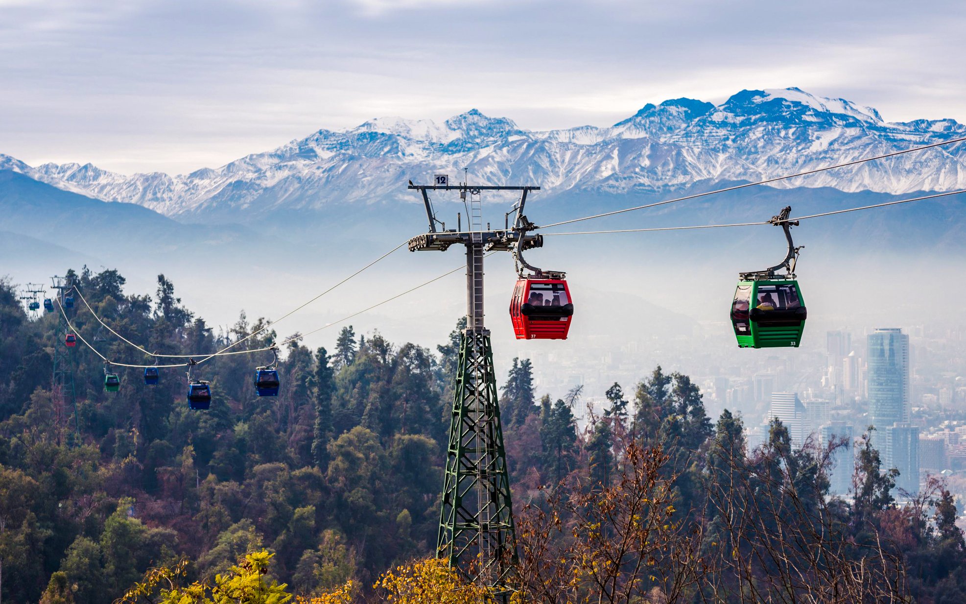 Santiago cable car with Andes mountains in the background.