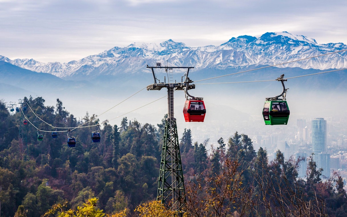 Santiago cable car with Andes mountains in the background.