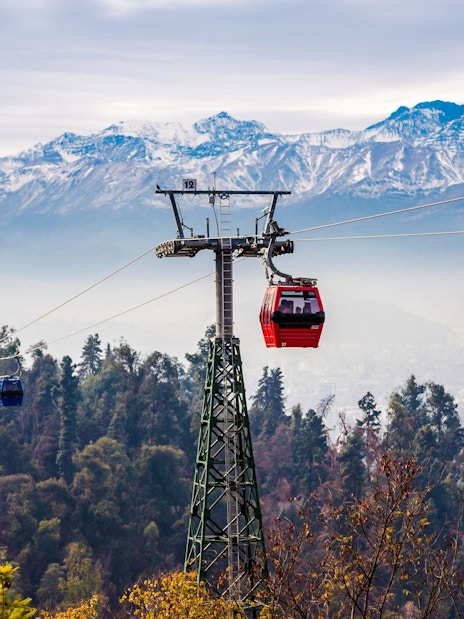 Santiago cable car with Andes mountains in the background.