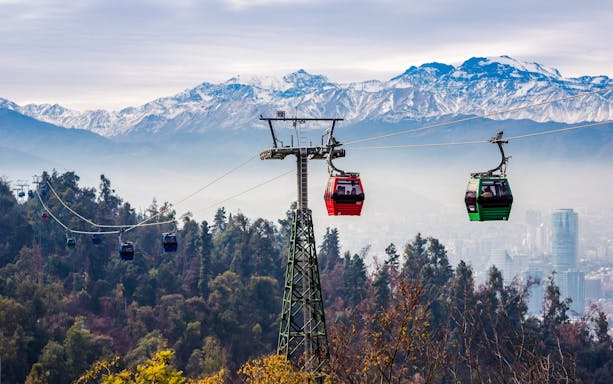 Santiago cable car with Andes mountains in the background.