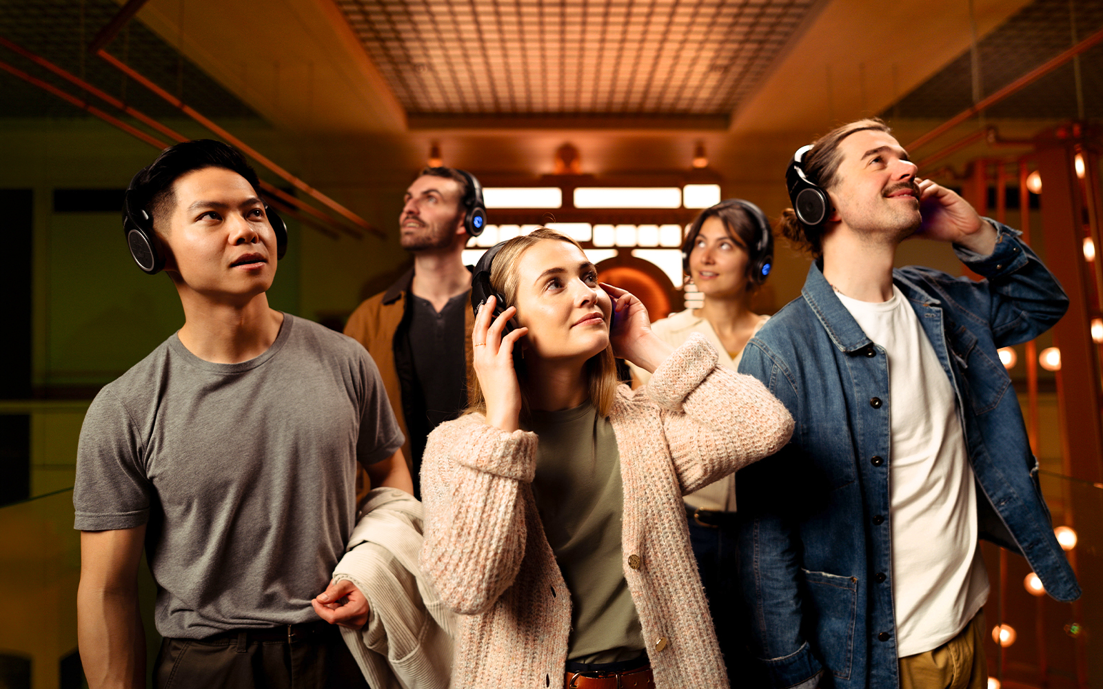 Visitors enjoying an audio tour at the Prague Pilsner Urquell Experience.