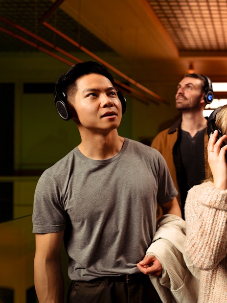 Visitors enjoying an audio tour at the Prague Pilsner Urquell Experience.