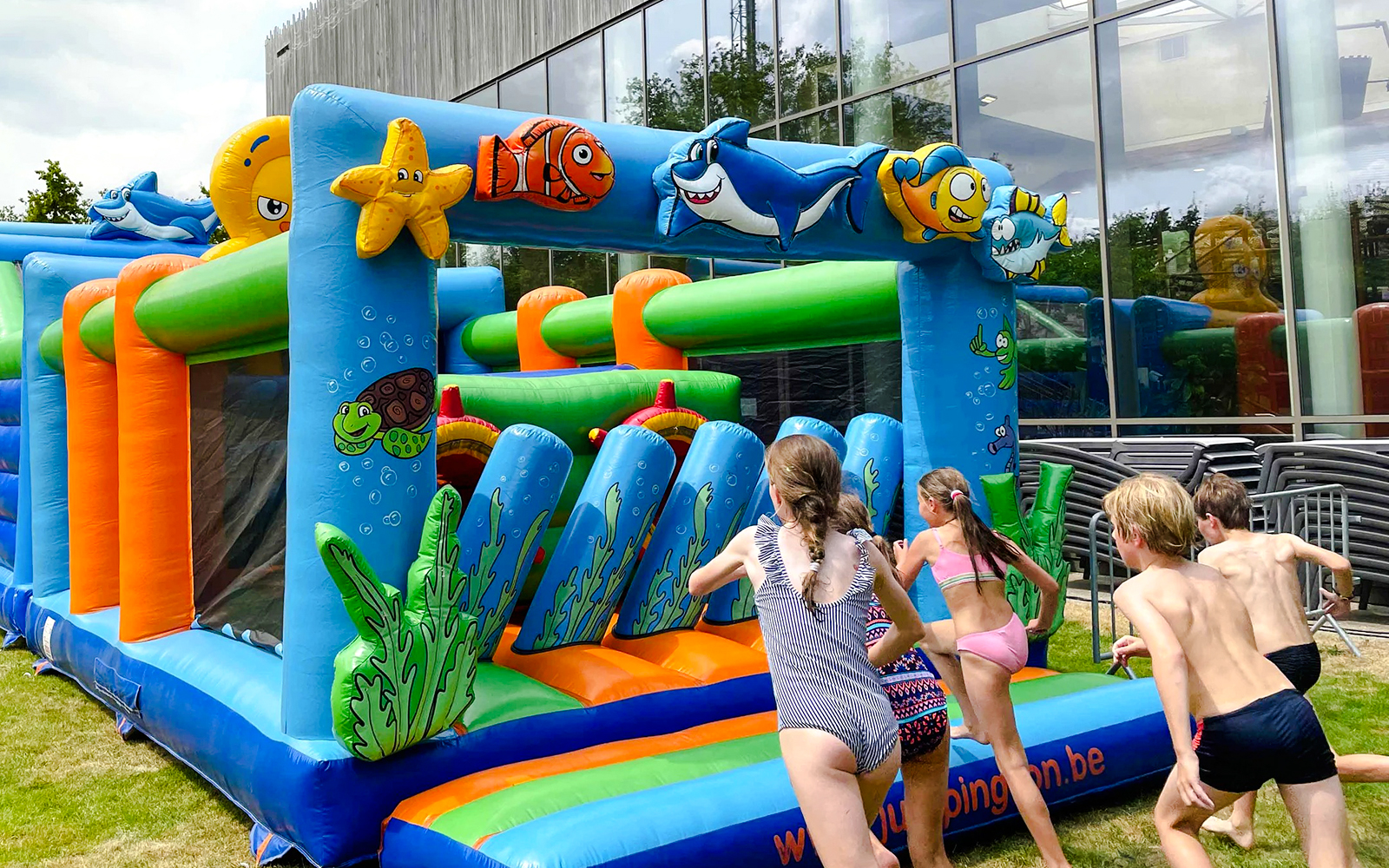 Children playing on an inflatable obstacle course at Bellewaerde Aquapark kids play area.