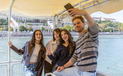 Group taking a selfie on a Budapest Danube River sightseeing cruise.