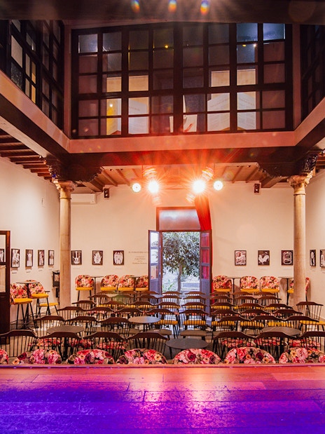Palacio Flamenco Granada interior with stage and seating for flamenco show.