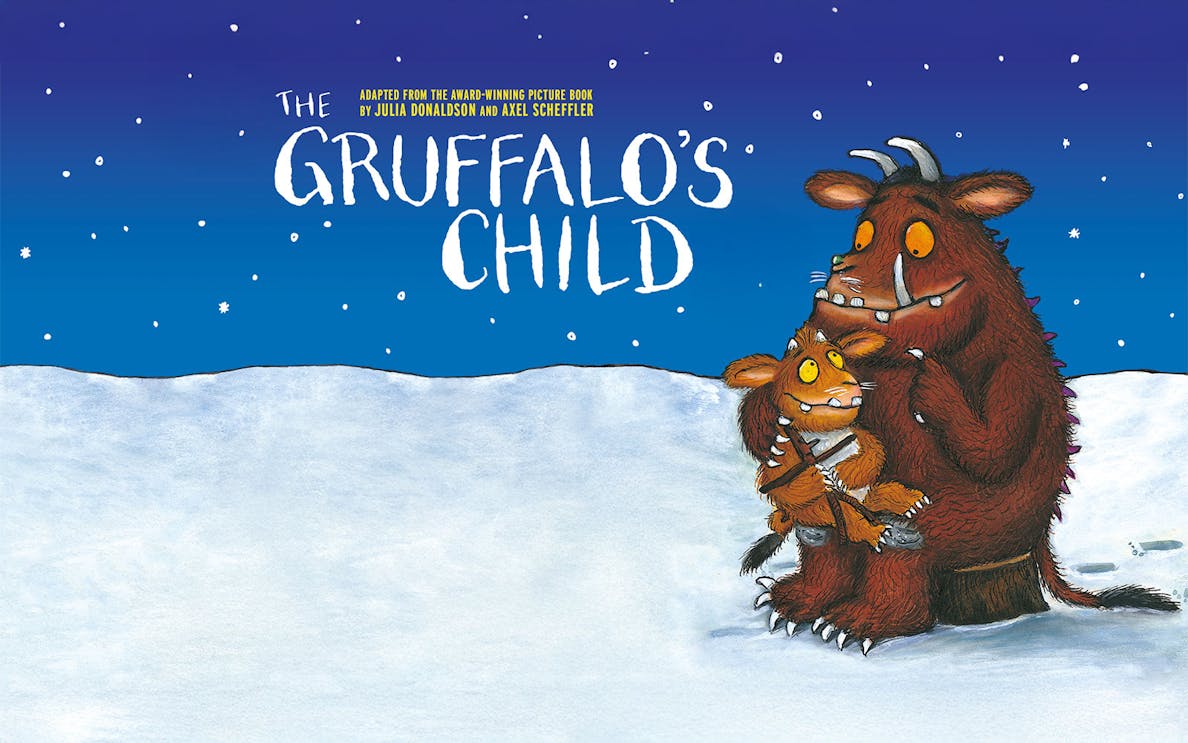 Gruffalo and child in snowy landscape under starry sky.