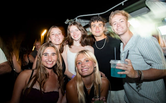 Group enjoying Split pub crawl with drinks and nightlife atmosphere.