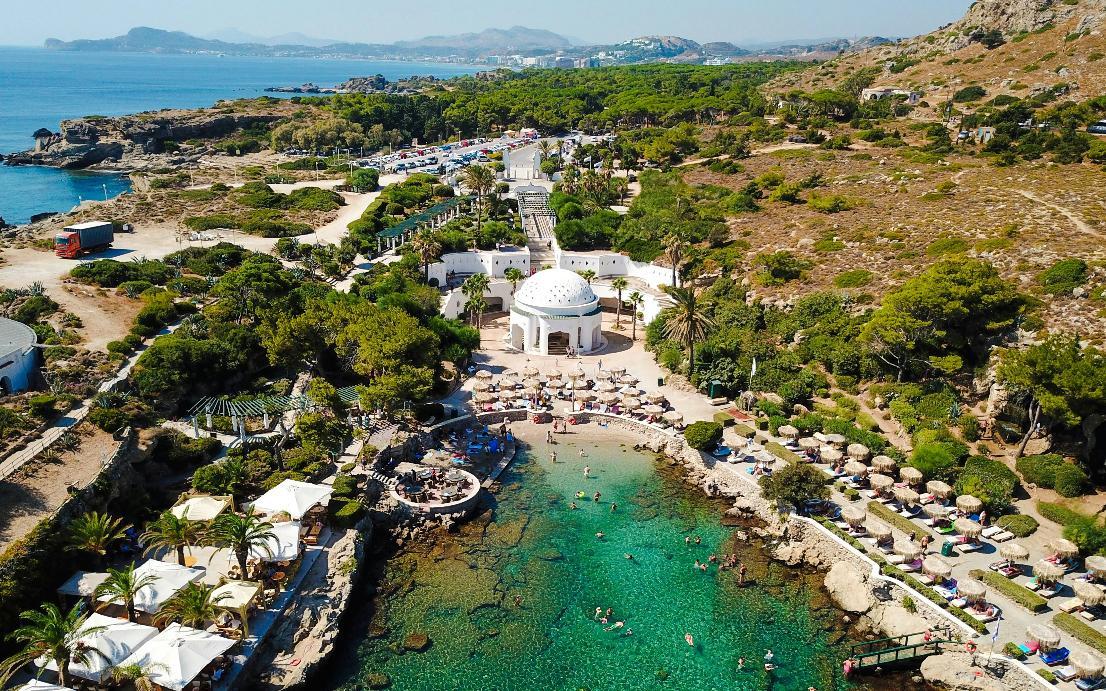 Aerial view of Kallithea Springs in Rhodos, Greece, showing the domed building and beach area.