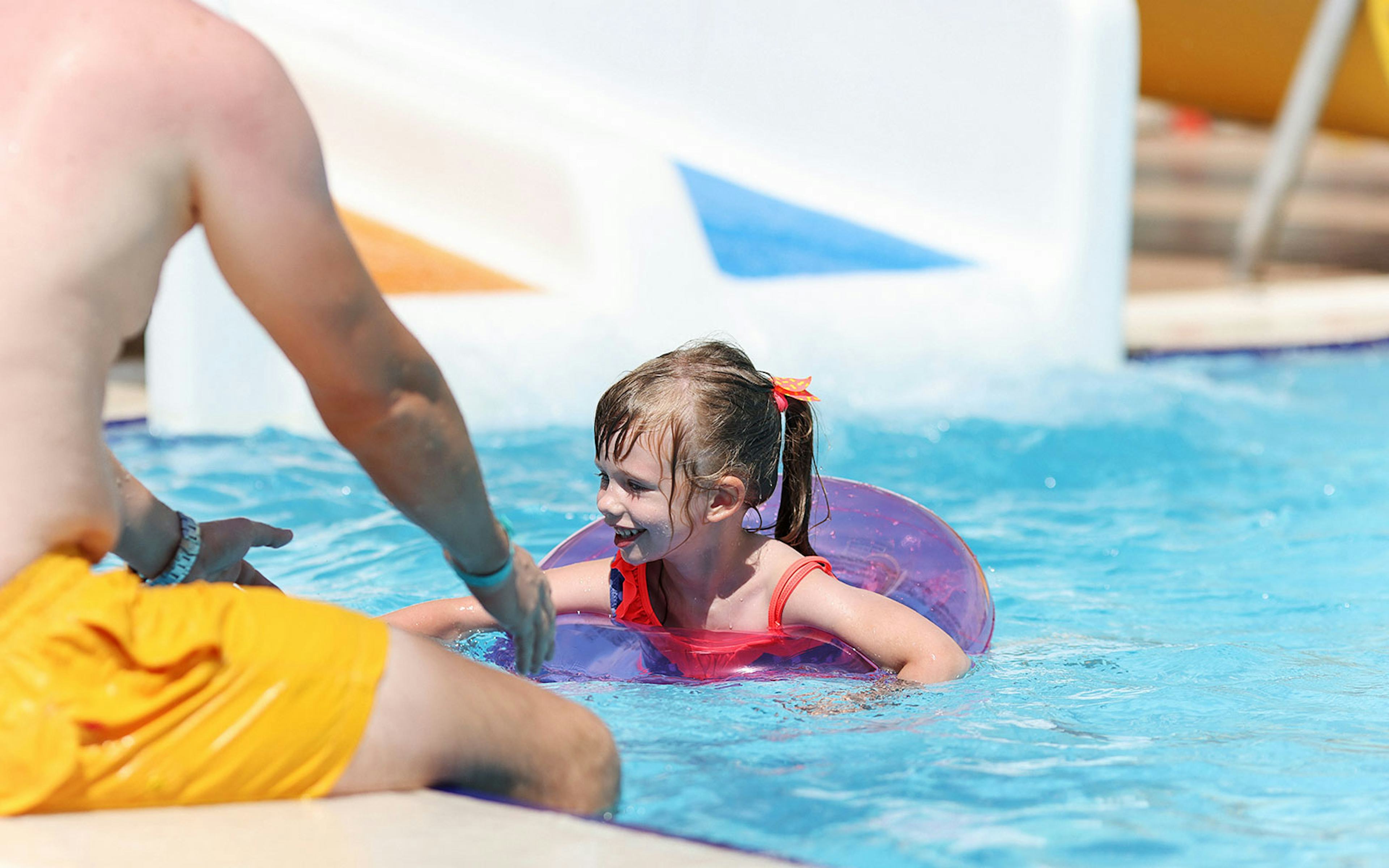 Child enjoying pool at Atlantis Dubai water park.