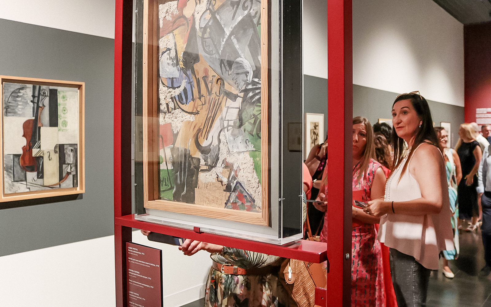 Visitors viewing abstract art at the Russian Museum exhibition.
