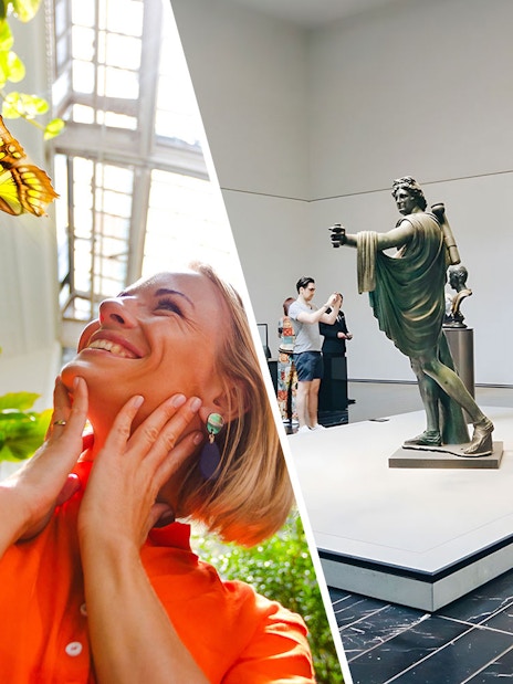 Tourists enjoying The Butterfly Garden and museum sculptures.