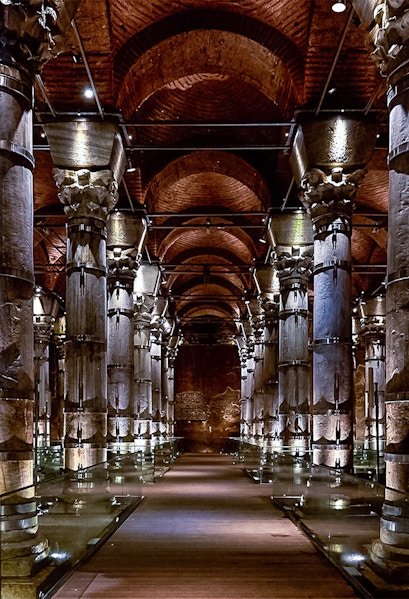 Cistern of Theodosius in Istanbul with illuminated columns and vaulted ceilings.
