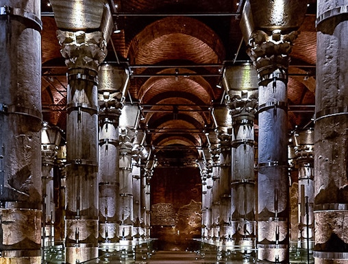 Cistern of Theodosius in Istanbul with illuminated columns and vaulted ceilings.