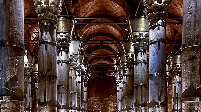 Cistern of Theodosius in Istanbul with illuminated columns and vaulted ceilings.