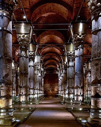 Cistern of Theodosius in Istanbul with illuminated columns and vaulted ceilings.