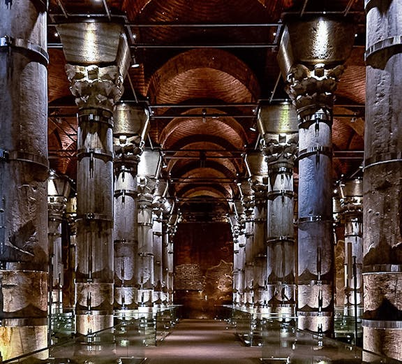 Cistern of Theodosius in Istanbul with illuminated columns and vaulted ceilings.