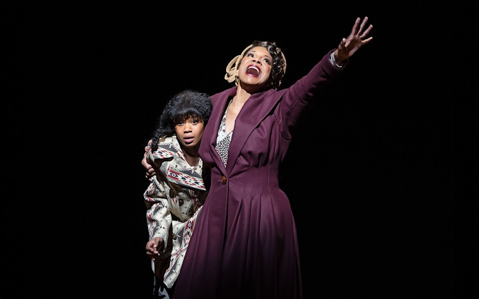Two performers on stage in a dramatic scene from the musical "Gypsy.