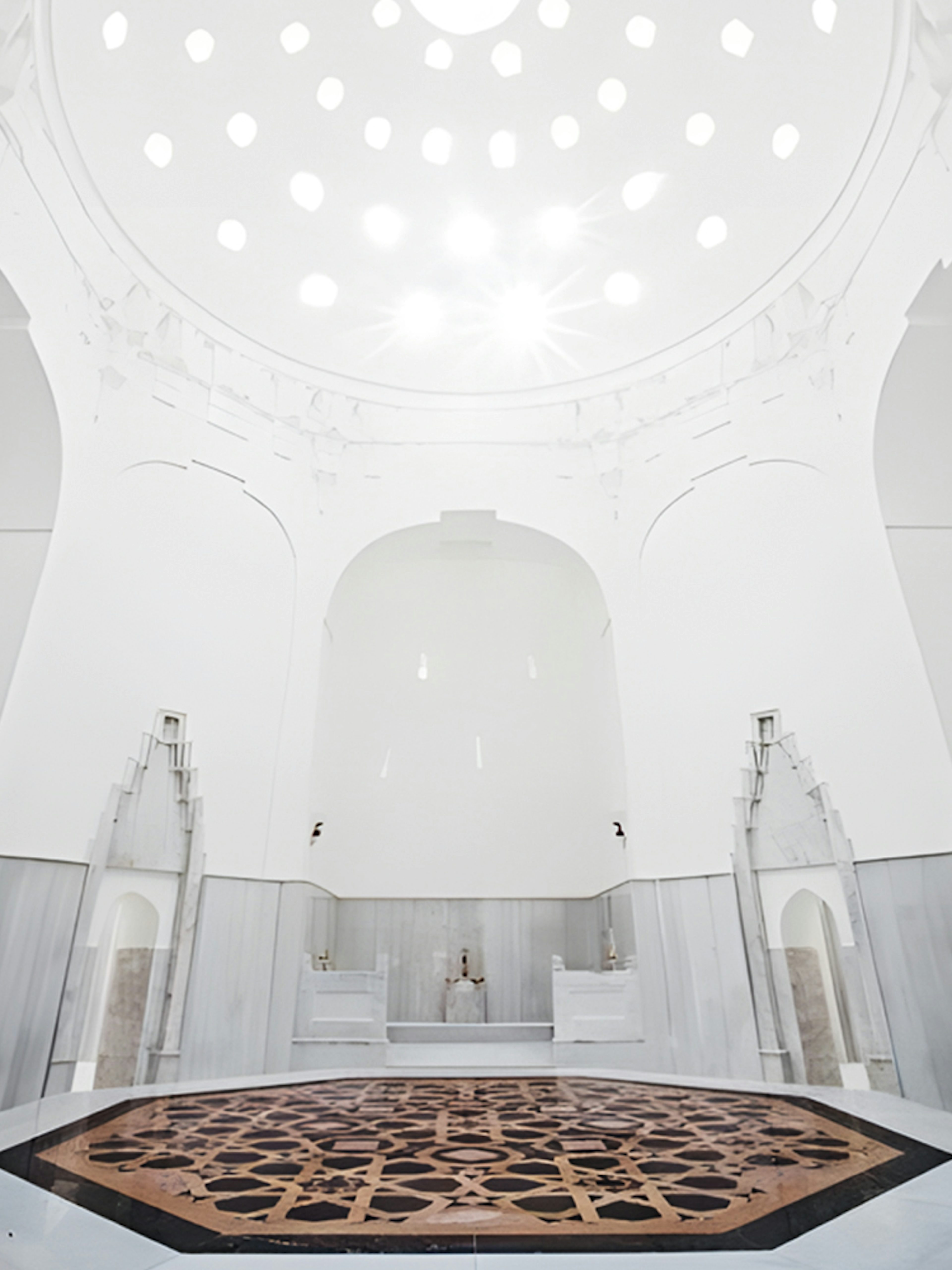 Hurrem Sultan Hamam interior with ornate marble basin in Istanbul.