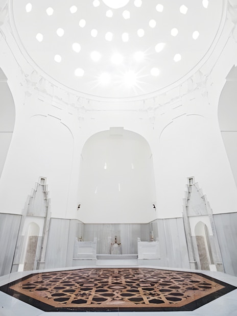 Hurrem Sultan Hamam interior with ornate marble basin in Istanbul.