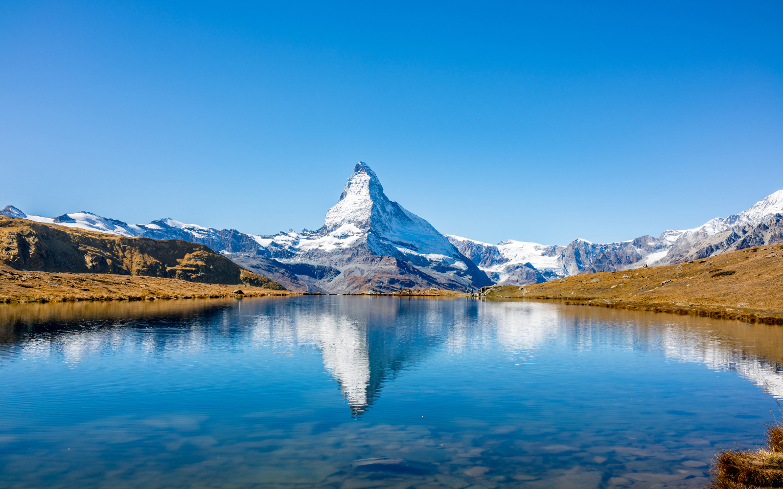 Matterhorn reflected in a clear alpine lake, Zermatt, Switzerland.