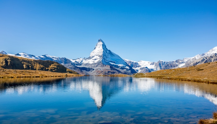 Matterhorn reflected in a clear alpine lake, Zermatt, Switzerland.