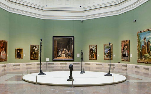 Prado Museum gallery with paintings and sculptures on display.