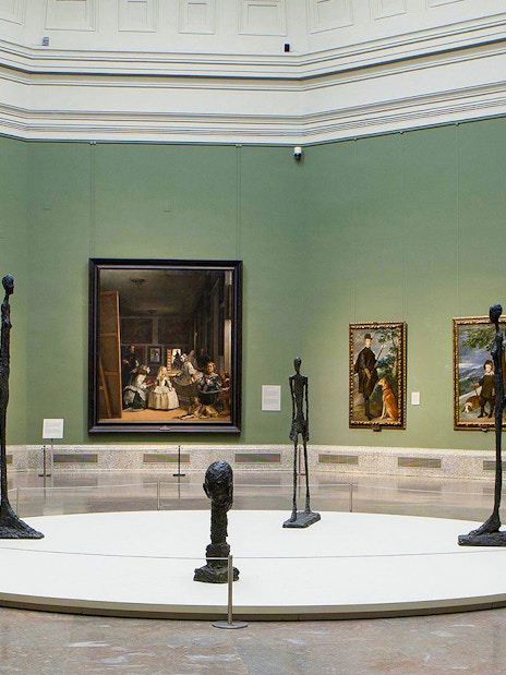 Prado Museum gallery with paintings and sculptures on display.
