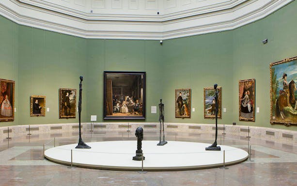 Prado Museum gallery with paintings and sculptures on display.