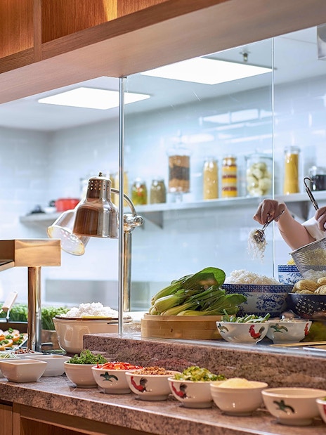 Chef preparing noodles at Plaza Premium Lounge, next to Aerotel Kuala Lumpur, gateway@klia2.