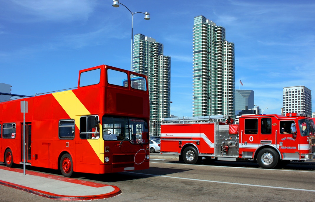 San Diego public transport bus on city street with palm trees in background