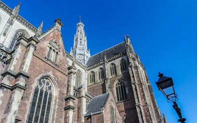 Grote Kerk in Haarlem with its Gothic architecture on a sunny day.