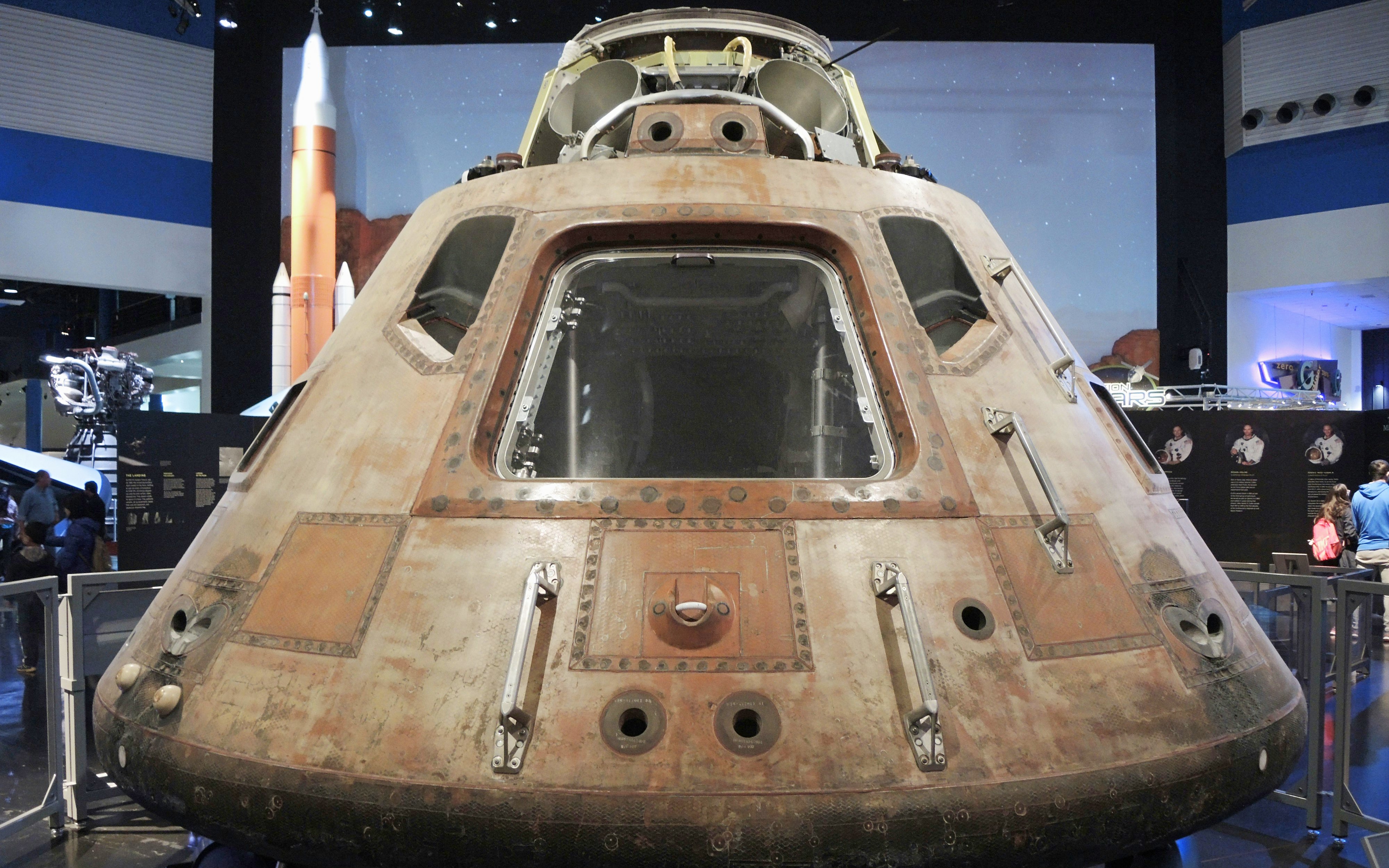 Apollo 11 Command Module Columbia on display in a museum exhibit.