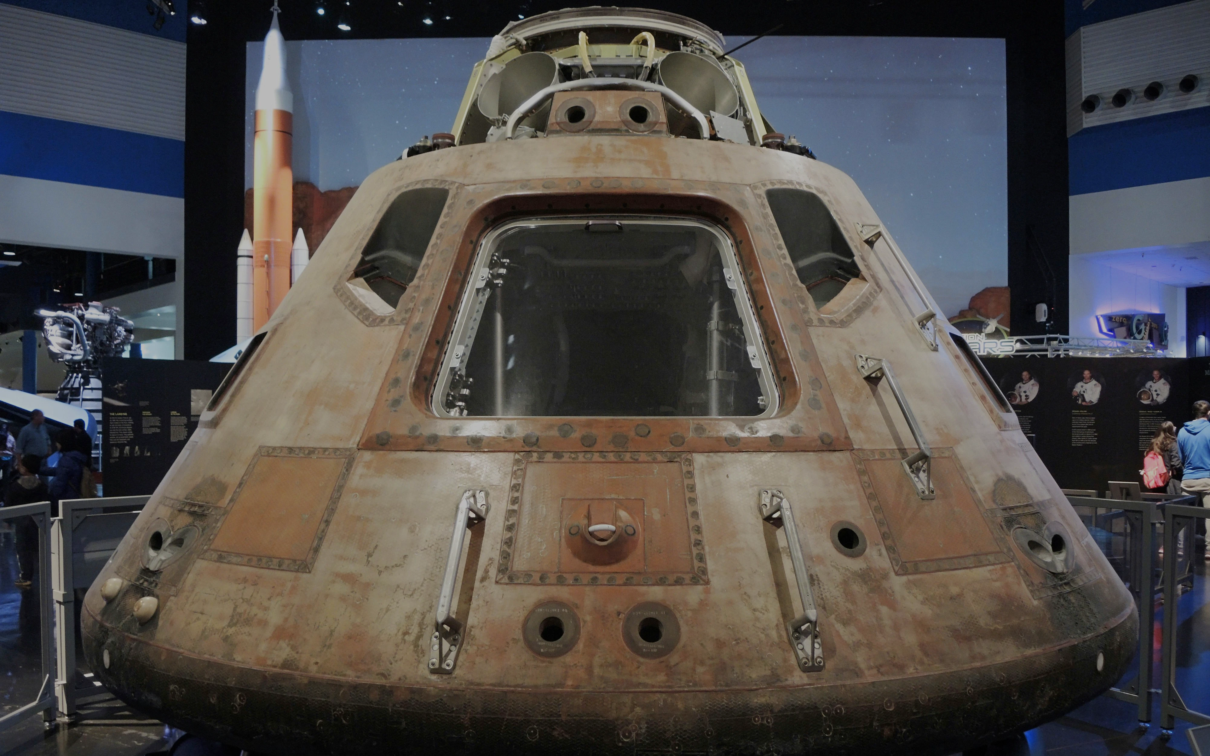 Apollo 11 Command Module Columbia on display in a museum exhibit.
