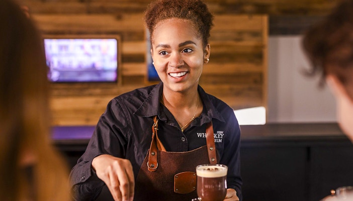 Barista preparing Irish coffee