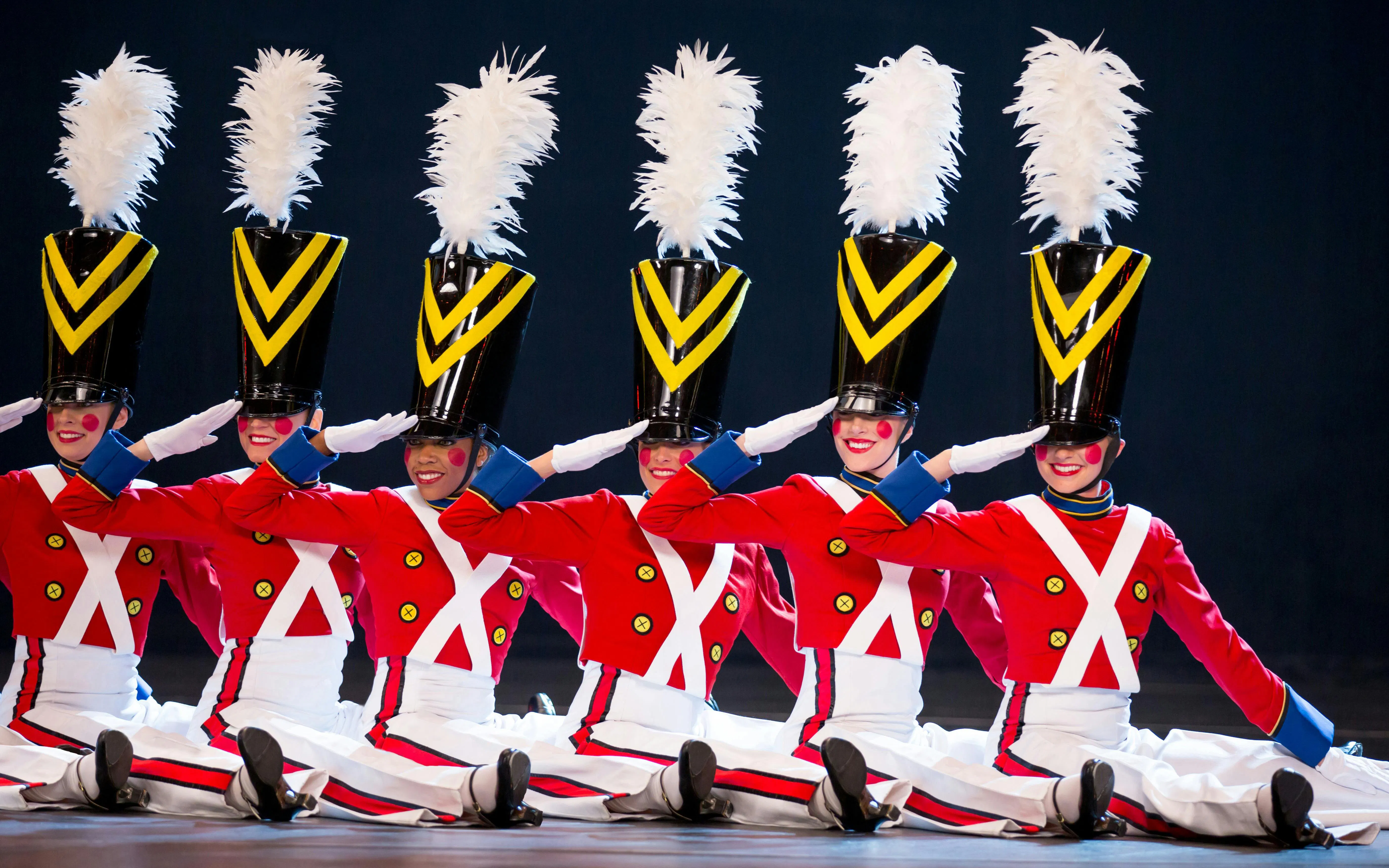 Radio City Rockettes performing in toy soldier costumes during Christmas Spectacular.