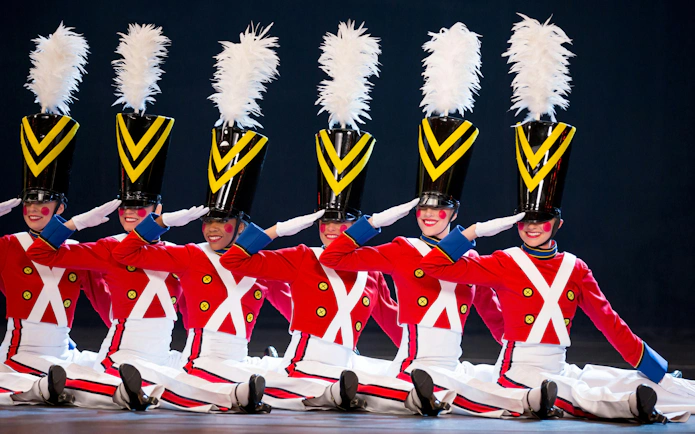 Radio City Rockettes performing in toy soldier costumes during Christmas Spectacular.