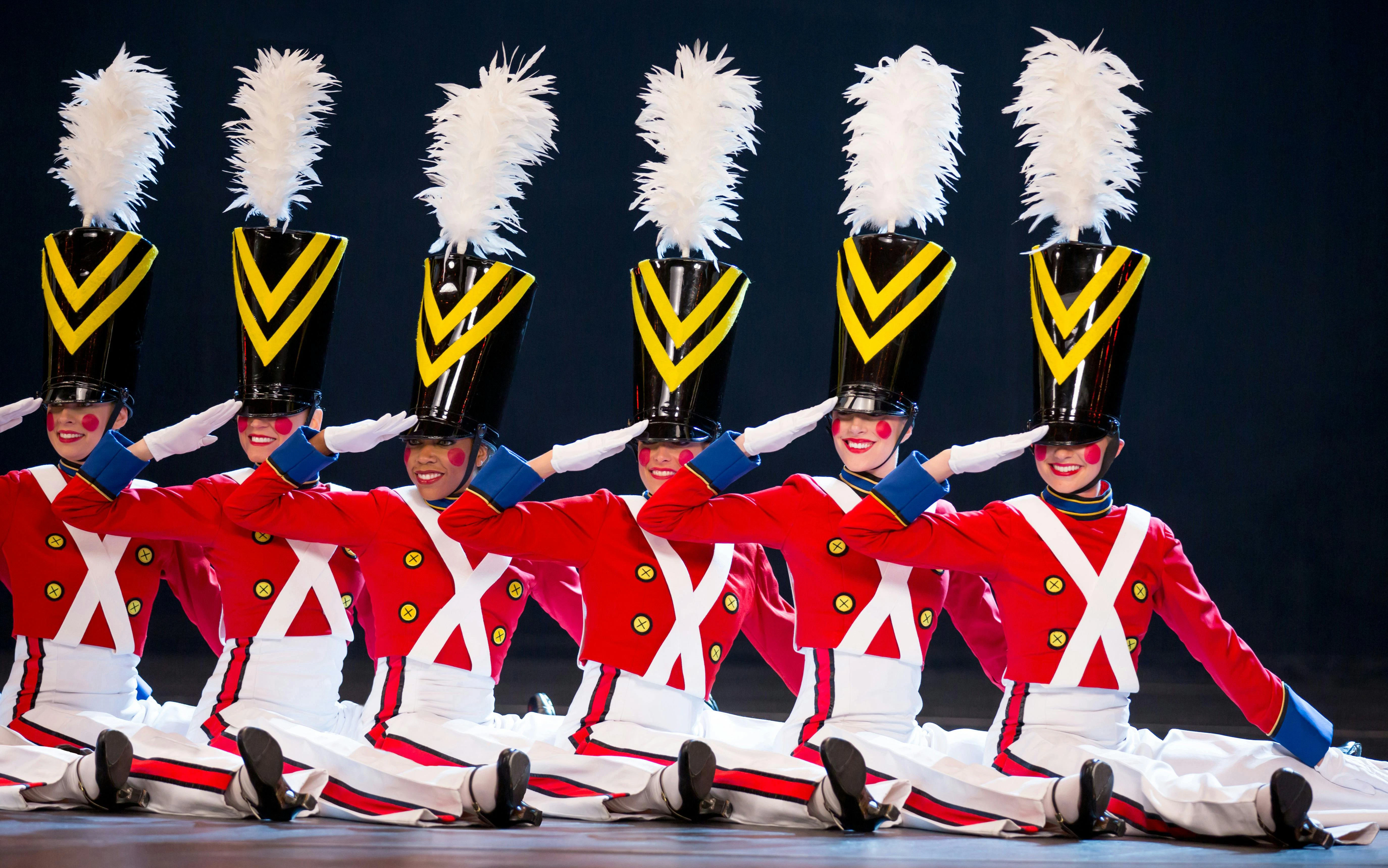 Radio City Rockettes performing in toy soldier costumes during Christmas Spectacular.