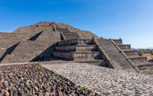 People climbing the Pyramid of the Moon in Teotihuacan, Mexico.