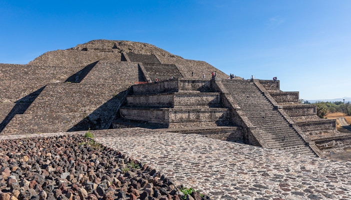 People climbing the Pyramid of the Moon in Teotihuacan, Mexico.